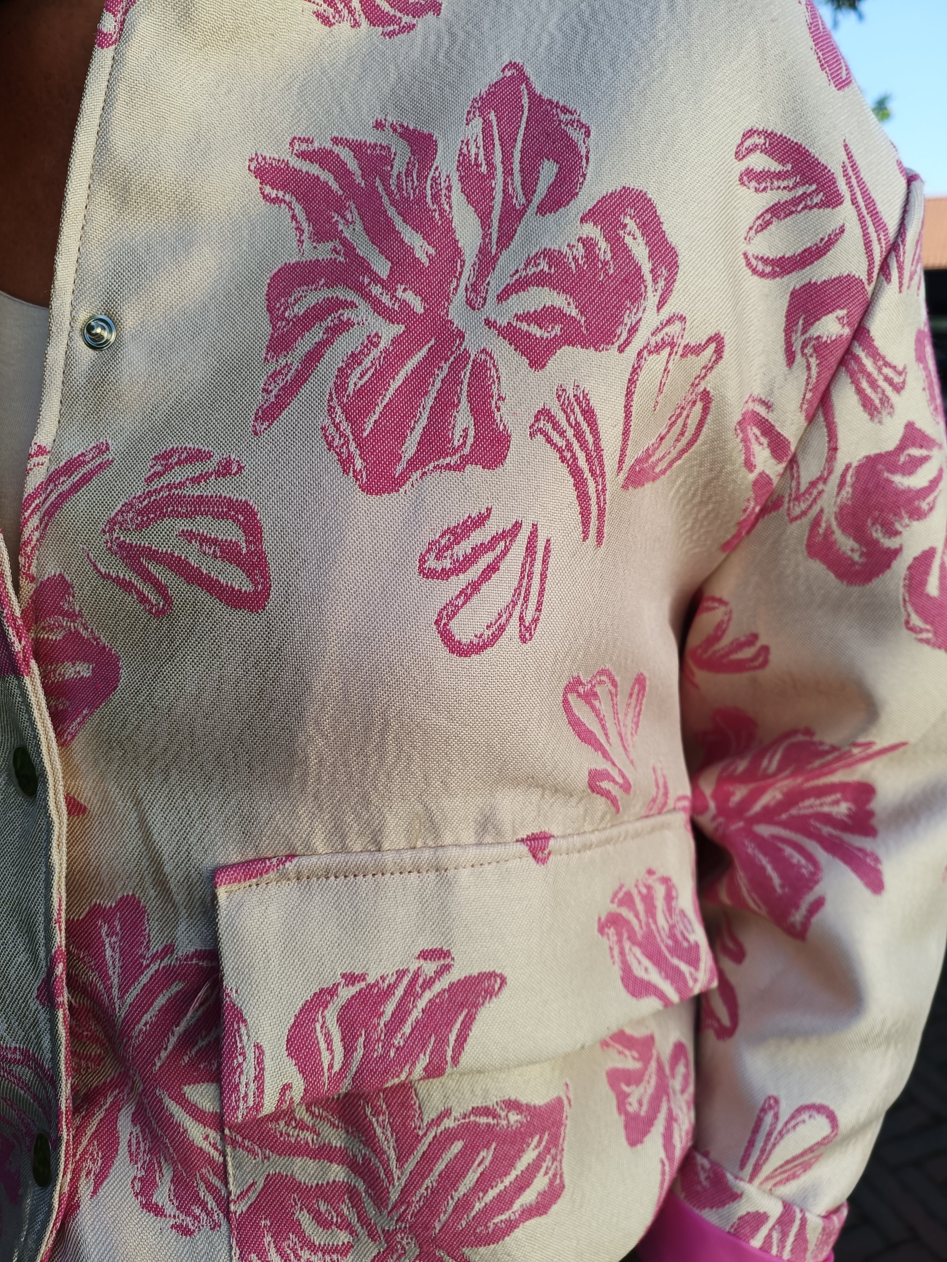 Jas roze bloem